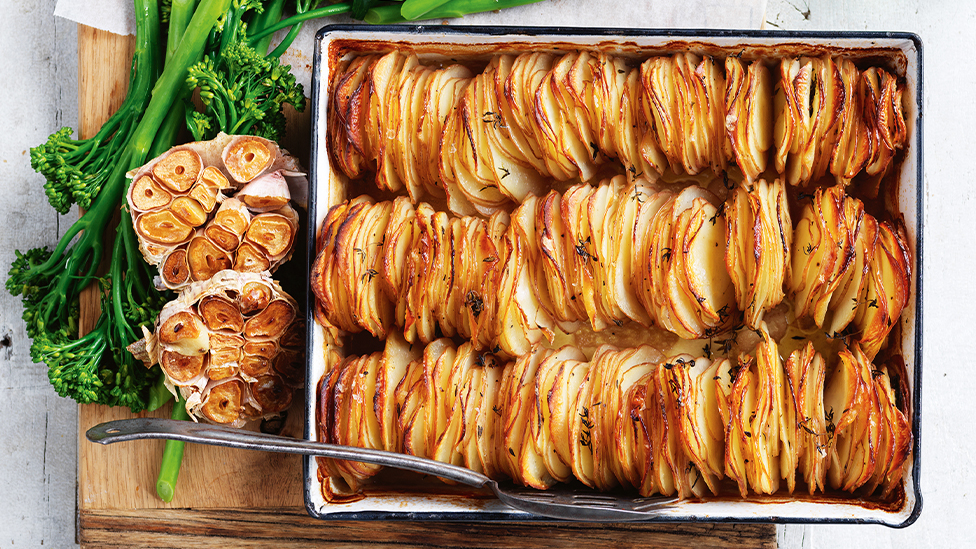 Garlic and thyme potato stack in a baking tray