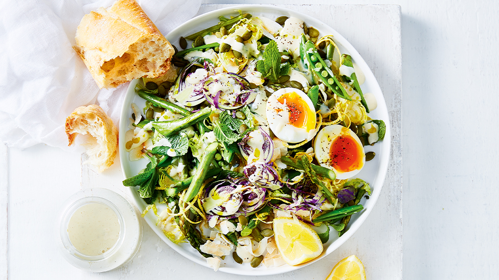 Green salad with egg and shredded brussels sprouts