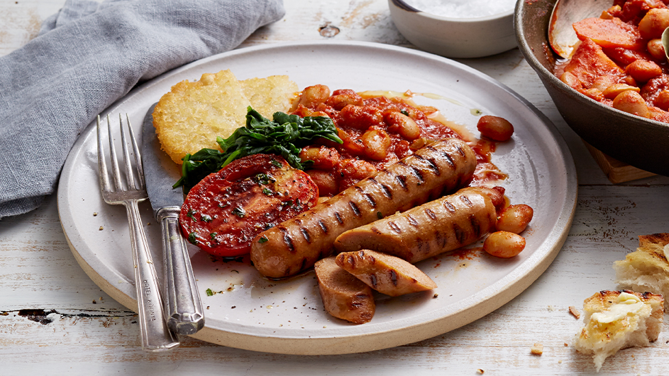 Grilled beef sausages with homemade baked beans