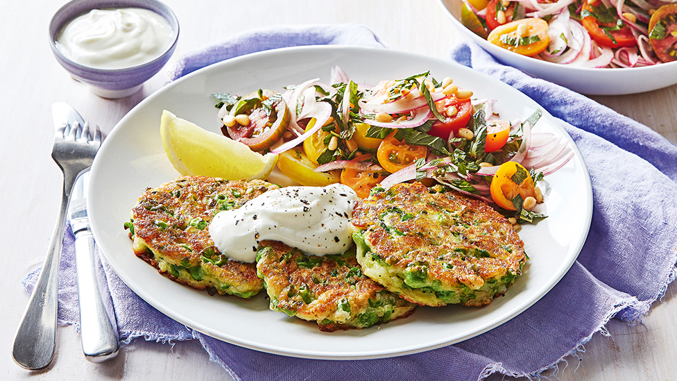 Haloumi and pea fritters with tomato salad