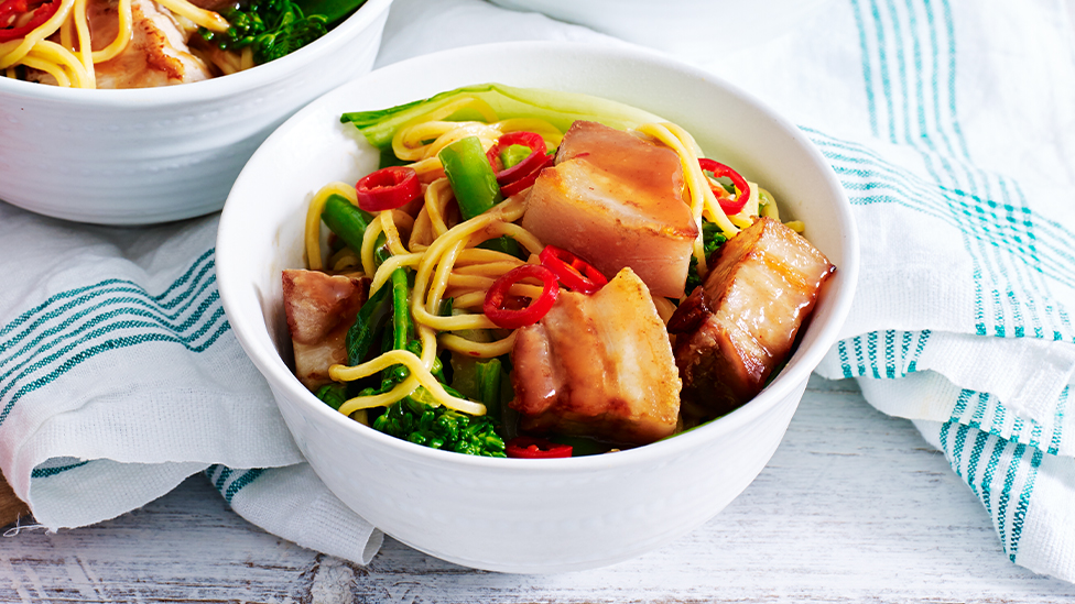 Bowl of hoisin and orange pork belly noodle stir-fry