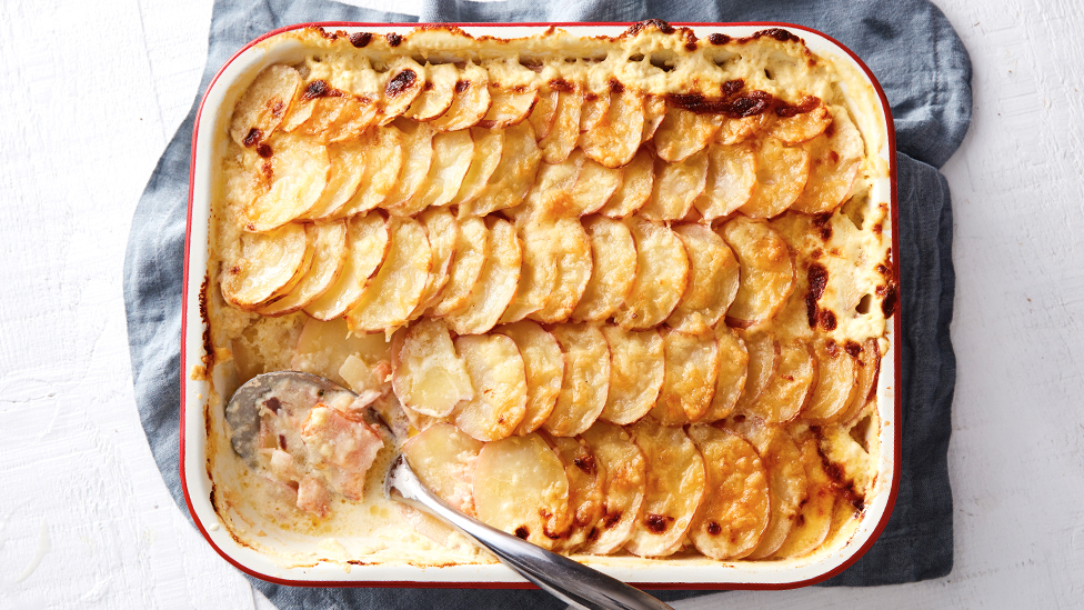 Hot smoked salmon and potato gratin in a baking dish