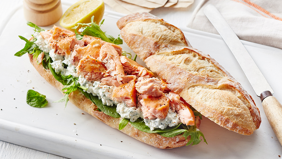 Hot smoked salmon with cottage cheese sub on a chopping board