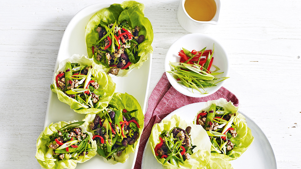 Lamb and black bean stir-fry in lettuce cups