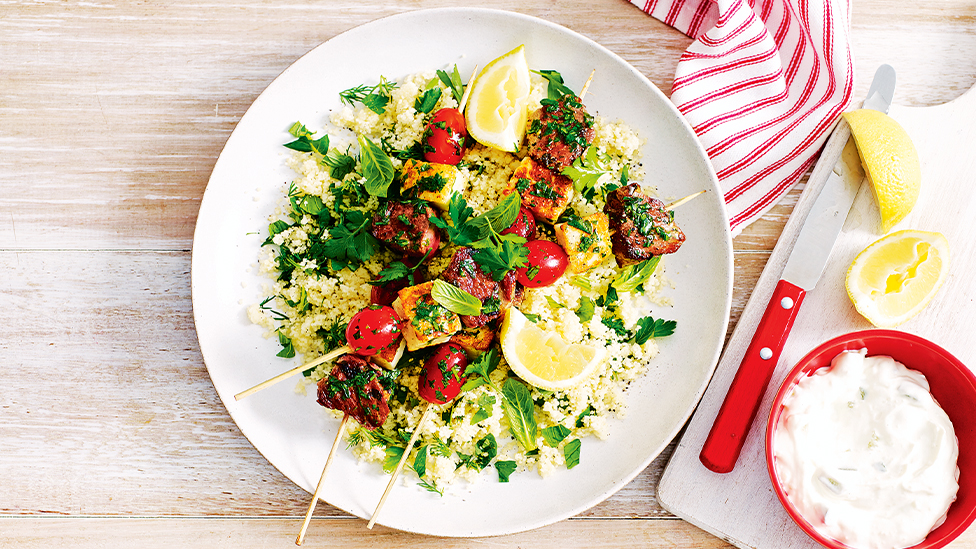 Lamb, tomato and haloumi skewers with herbed couscous