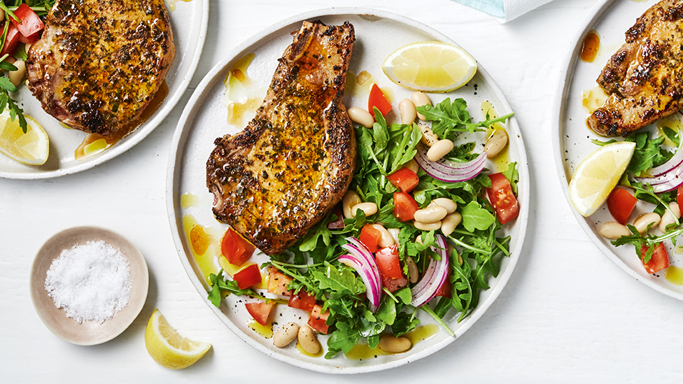 Pan-fried pork chops with white bean and tomato salsa
