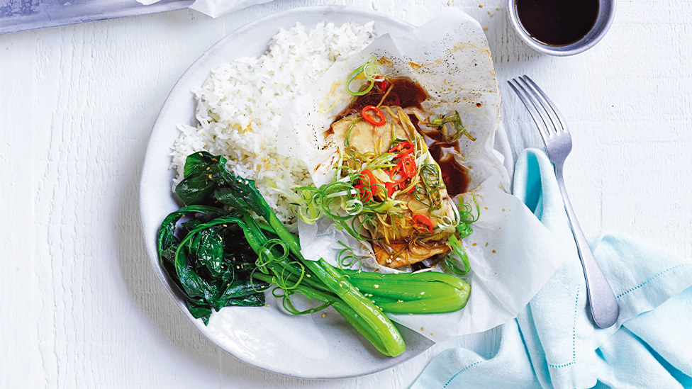 Paper-baked barramundi with spring greens