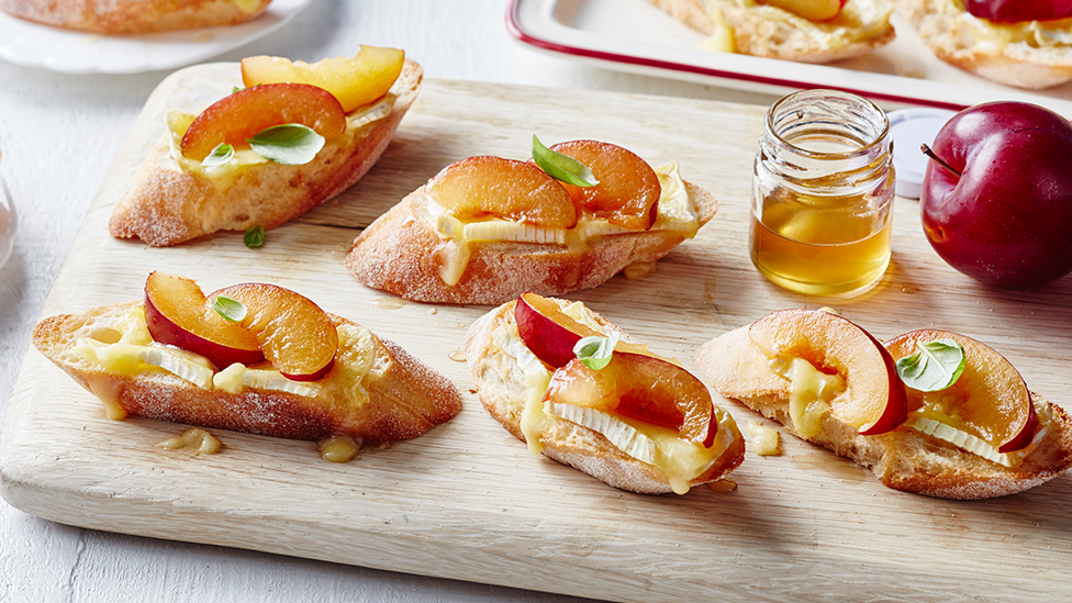 Plum and brie crostini