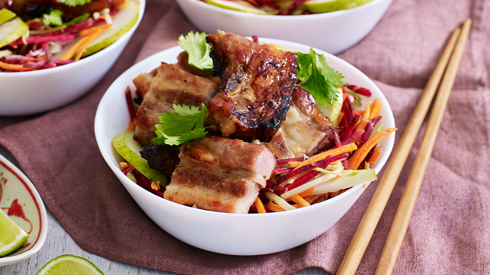 Plum and chilli pork ribs with crunchy pear coleslaw