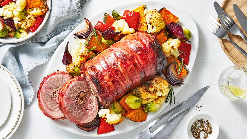Prosciutto-wrapped lamb roast with veggies