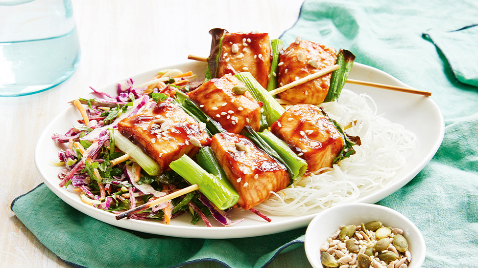 Quick sticky salmon skewers with kale slaw