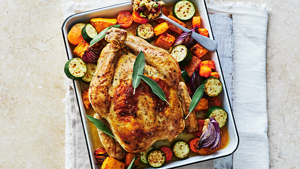 Roast chicken with garlic and sage butter and cranberry stuffing