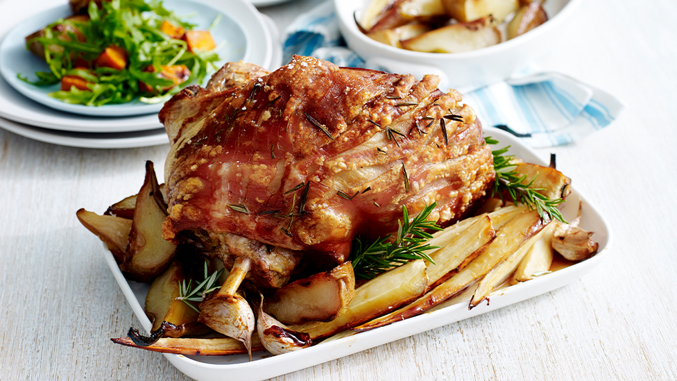 Roast pork leg with caramelised pears and parsnips