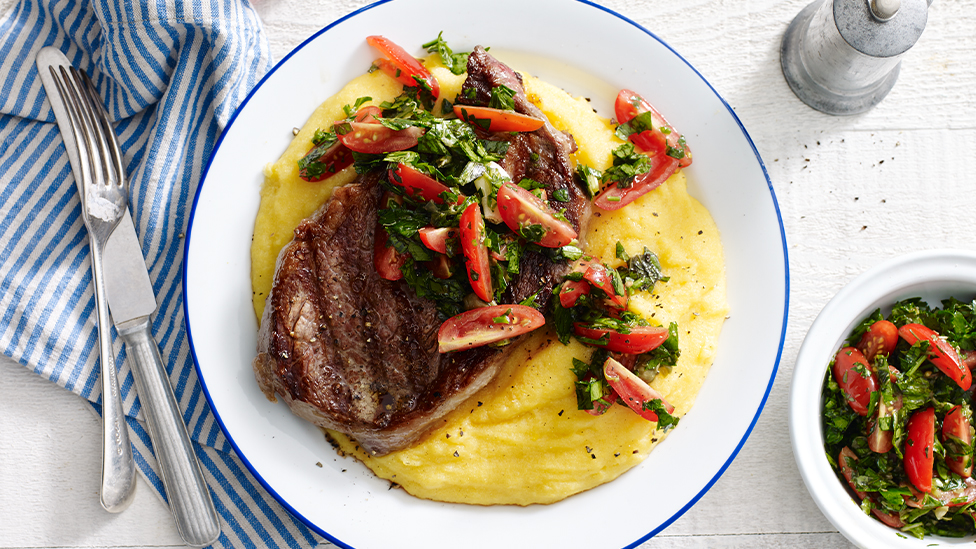 Scotch fillet steaks with parmesan polenta and tomato salsa verde