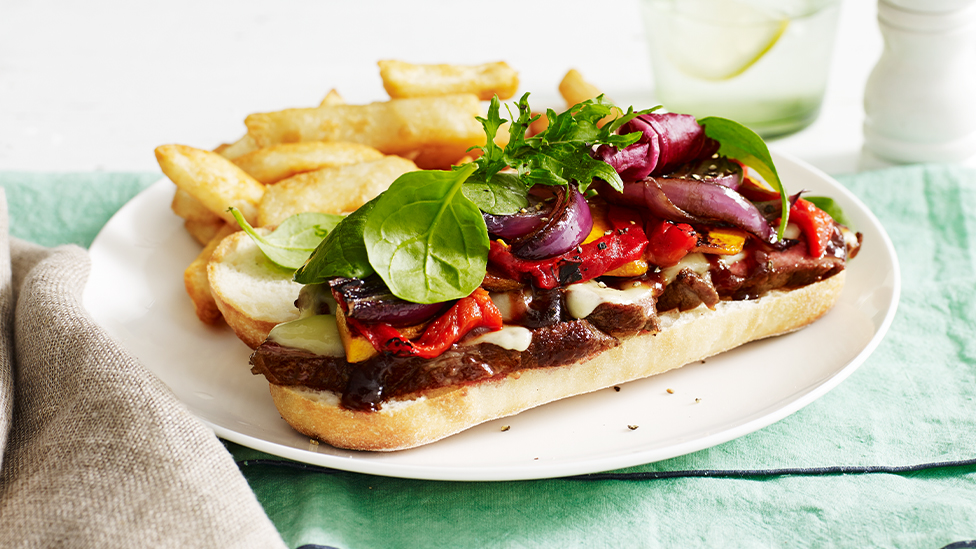 Steak and cheese sandwiches with beer-battered chips