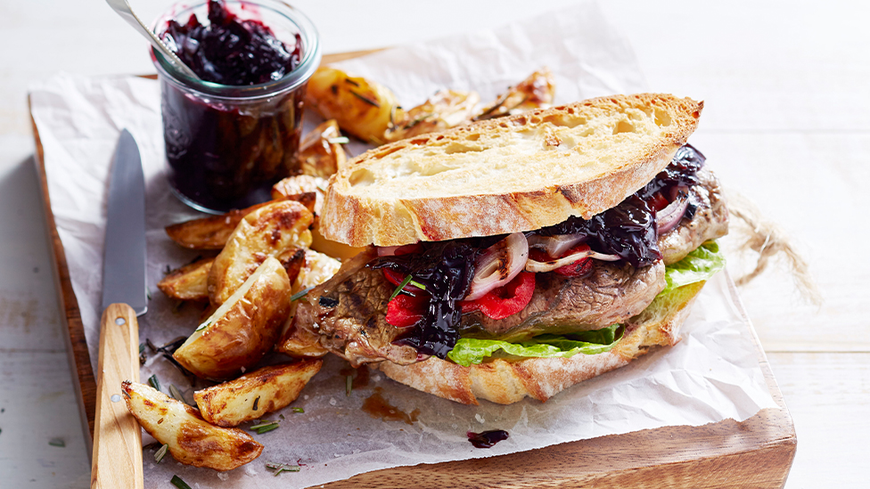 Steak sandwich with beetroot relish and rosemary wedges