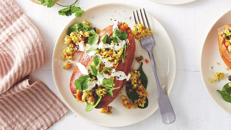 Sweet potato stuffed with Moroccan-style grains