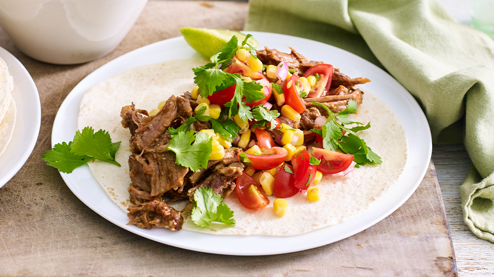 Tomato and paprika shredded lamb with corn salsa
