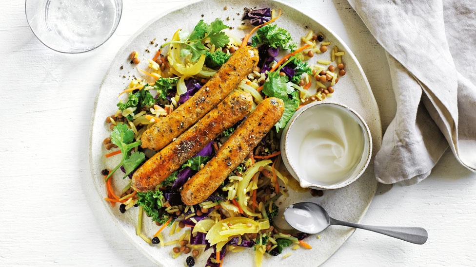 Veggie pilaf with vegan sausages