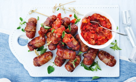 Bacon-wrapped beef sausages with tomato salsa