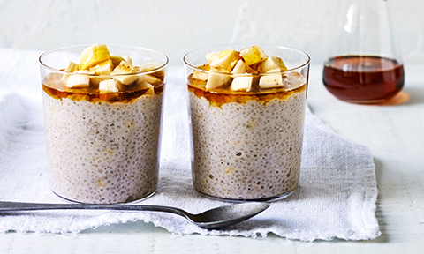 Two glasses filled with banana and coconut chia pudding