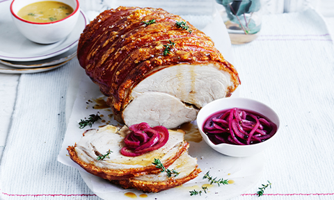 Crackling pork roast with pickled onions and cider jus