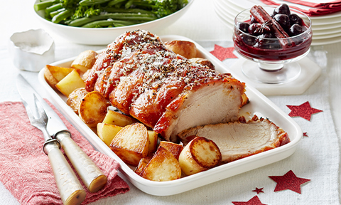 Crispy Christmas roast pork with spiced cherry port sauce