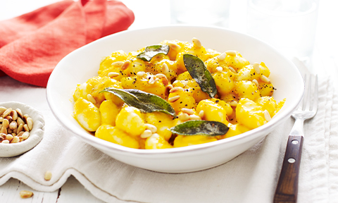Gnocchi with roasted pumpkin sauce, pinenuts and sage