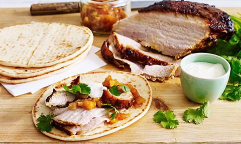 Roasted pork belly served with naan and mango chutney