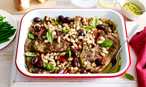 Lamb tray bake with pesto, tomatoes and olives