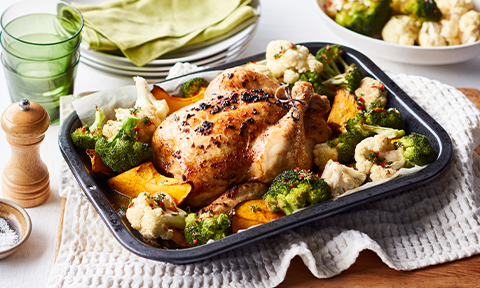 Lemon and garlic roast chicken with pumpkin and cauliflower