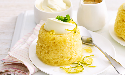 Lemon, lime and coconut steamed puddings with citrus syrup