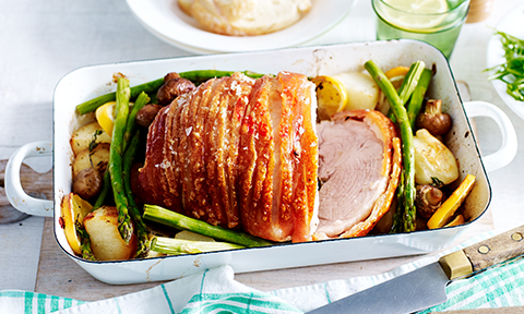 Roast pork with potatoes, lemon, mushrooms and asparagus