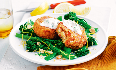 Salmon patties with baby broccoli, snow pea and almond salad
