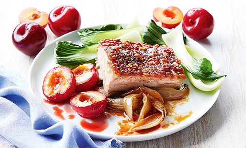 Slow-roasted pork belly with roasted plums