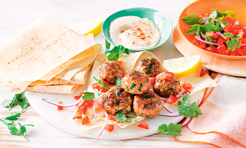 Spiced pork patties with tahini sauce