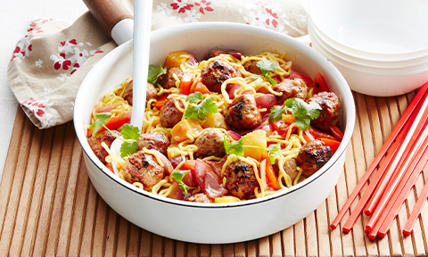 Sweet and sour pork meatballs with noodles