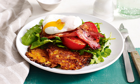 Sweet potato hash brown with tomato, bacon and egg