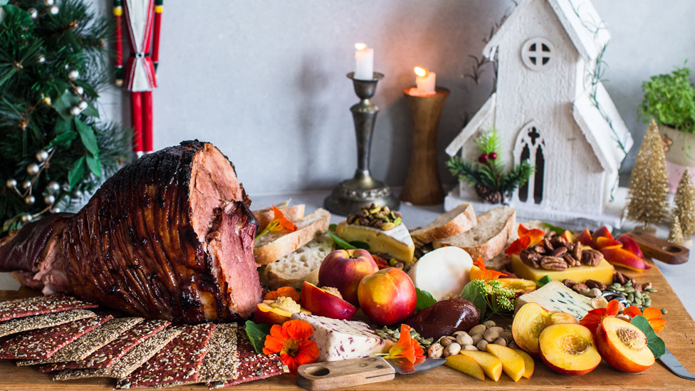 Quince glazed ham platter with cheeses, fruits, crackers and nuts