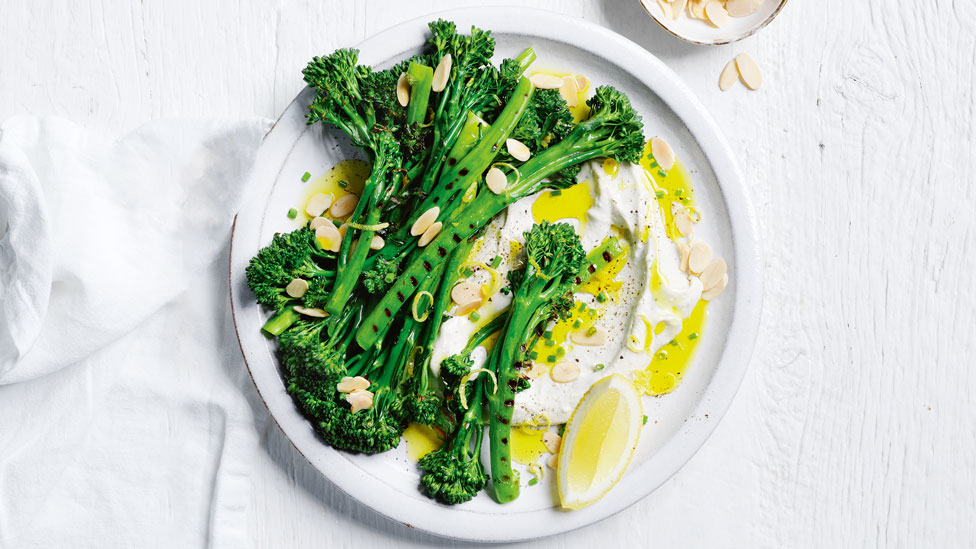 One serve of BBQ baby broccoli with blue cheese creme fraiche, dressed with lemon juice, almonds, chives and lemon zest