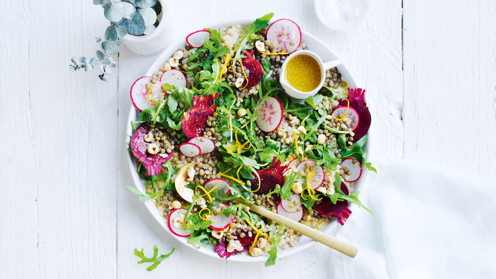 Fresh beetroot, barley, lentil and hazelnut salad, garnished with orange zest.