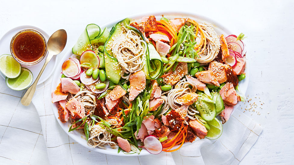 Soba noodle salad mixed with blackened-spiced salmon