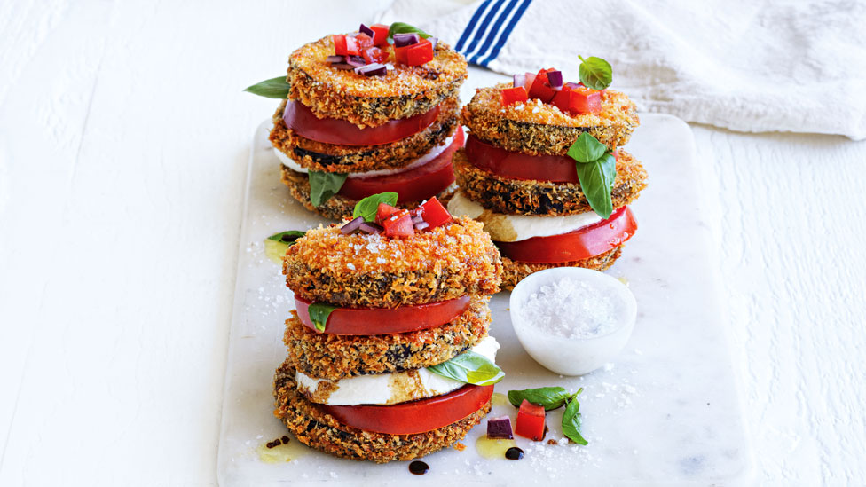 Three caprese stacks with crumbed eggplant