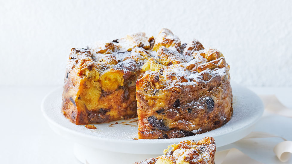 Chocolate panettone bread and butter pudding cake dusted with icing sugar