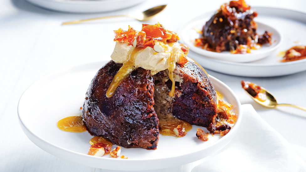 Christmas pudding topped with almond praline butter mixture