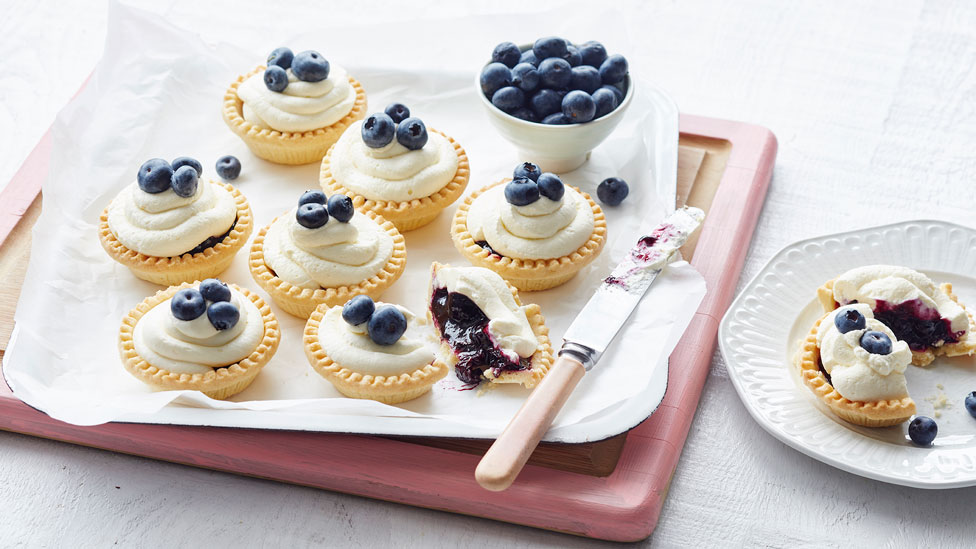 Eight blueberry mini tarts