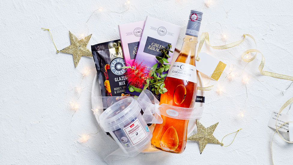 An entertaining hamper with rose, chocolate and dried fruit and nut