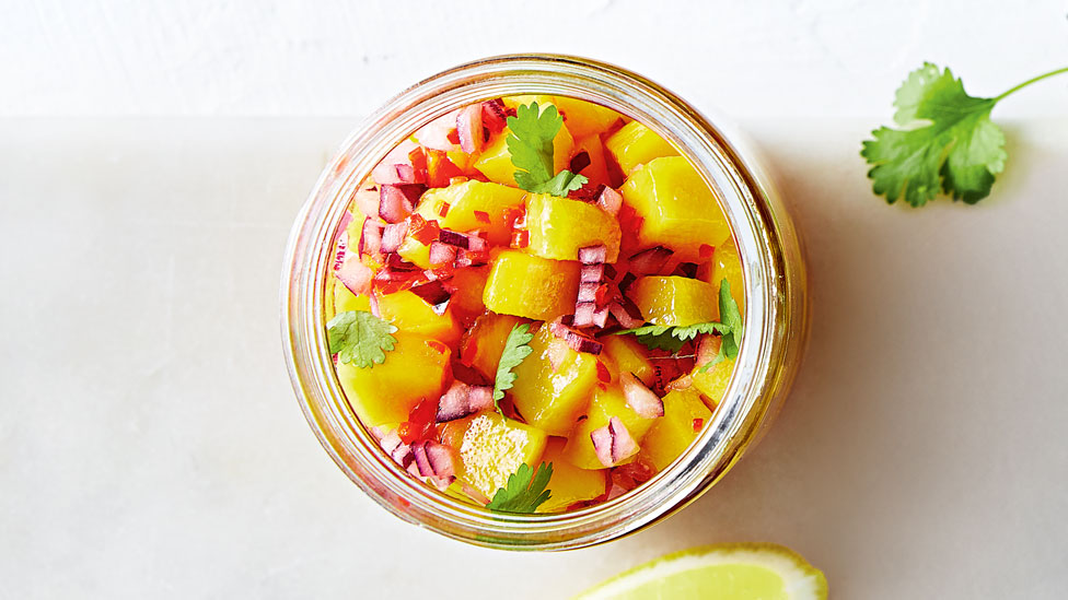 Fresh mango and chilli salsa, garnished with fresh coriander.