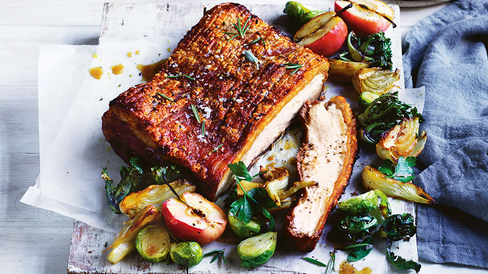 A rump of pork belly with caramelised apples and fresh fruit