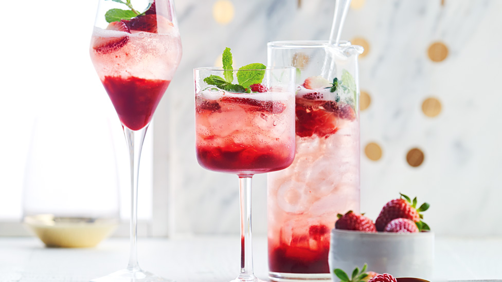 Three cups of raspberry and prosecco punch